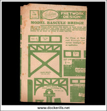 Vintage Fretwork Design Model Bascule Bridge instruction sheet, showing green printed bridge framing diagrams and cut lines on aged beige paper, photographed against a black background.