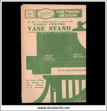 Vintage woodworking instruction sheet for a 'Table Centre Vase Stand' showing green technical diagrams and measurements on aged beige paper, set against a black background.
