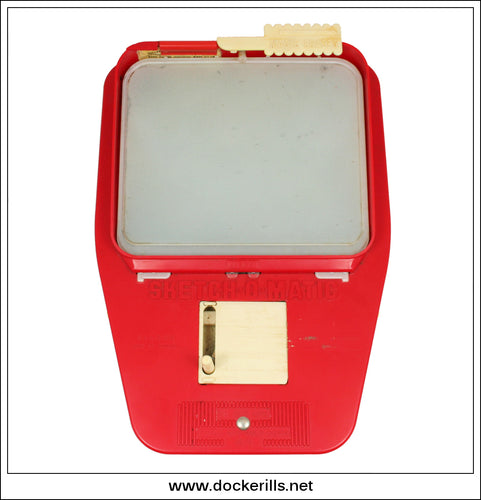 Vintage Merit Sketch-O-Matic drawing toy in red.