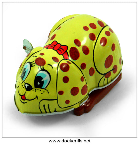 Vintage Jumping Dog Tin Plate Novelty Toy (Yellow). Clockwork / Wind-Up Novelty Toy, Yoneya, Japan.